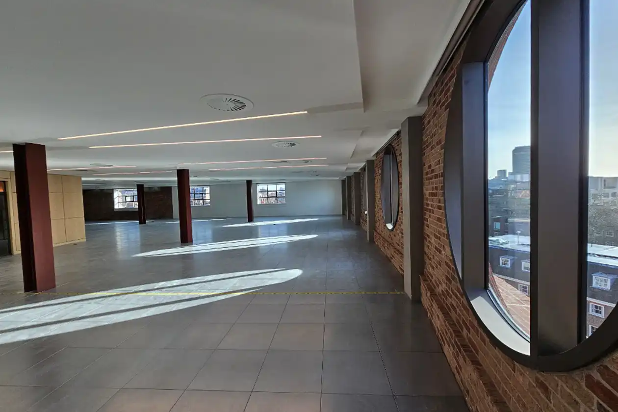 Interior with exposed brickwork and steel framed windows